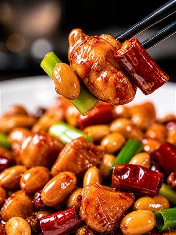 Curated Kung Pao Chicken sample with diced chicken, dried red chiles, peanuts, and glossy sauce